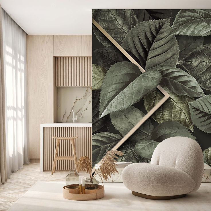 Papier peint feuillage moderne avec feuilles stylisées vert sauge, posé sur un mur de salon pour une décoration naturelle et contemporaine.