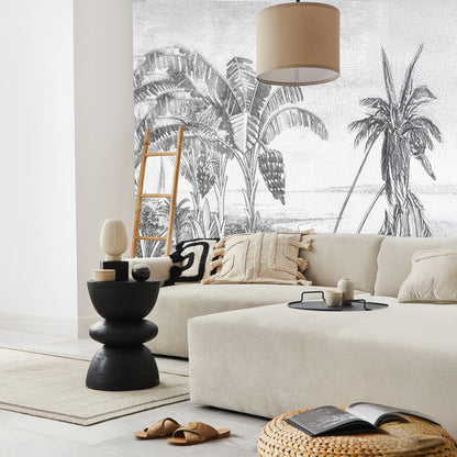 Ambiance moderne avec papier peint noir et blanc représentant une plage stylisée, parfait pour sublimer un salon élégant ou un espace détente cosy.